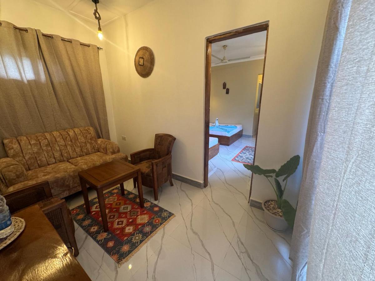 An open door leading through to the bathroom