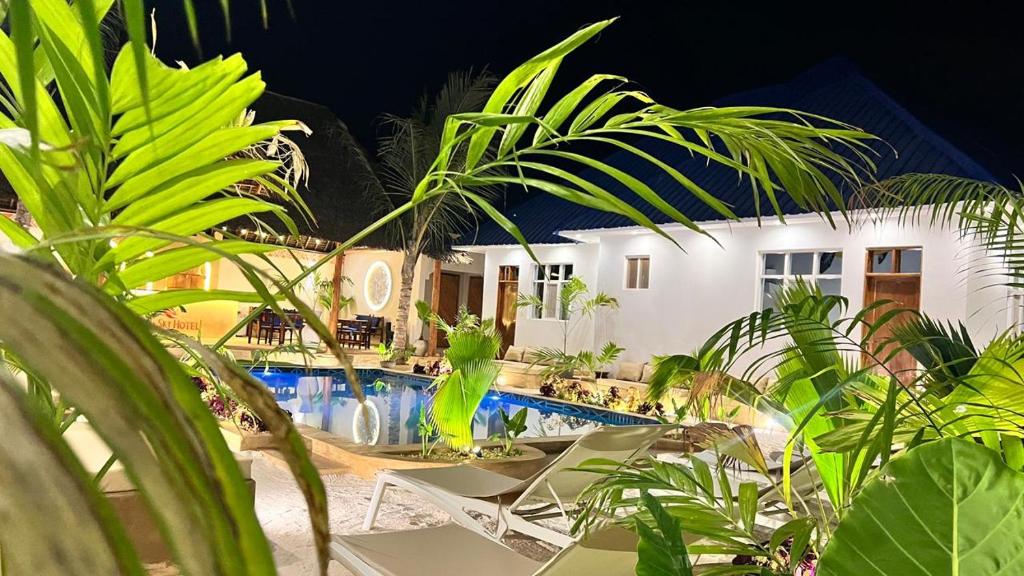 The planted garden and lit pool after dark